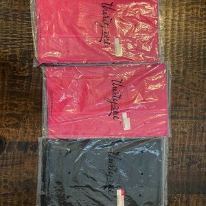 One large stand tall insert. Pink or black I have 2 pink one black. Nib